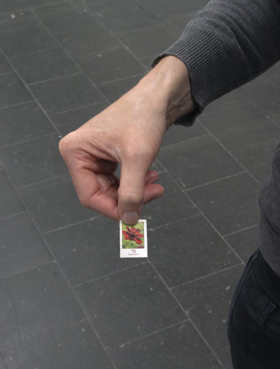 <p><em>A Letter</em>, carried by Regina Barunke, director of the Temporary Gallery, two stamps, various locations<br />photo: Hartwig Schwarz</p>